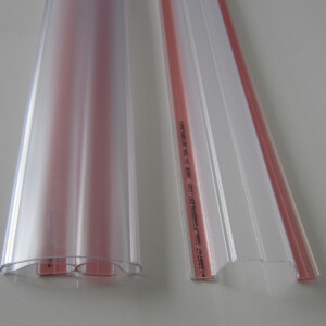 Clear door finger guards lying on white surface.