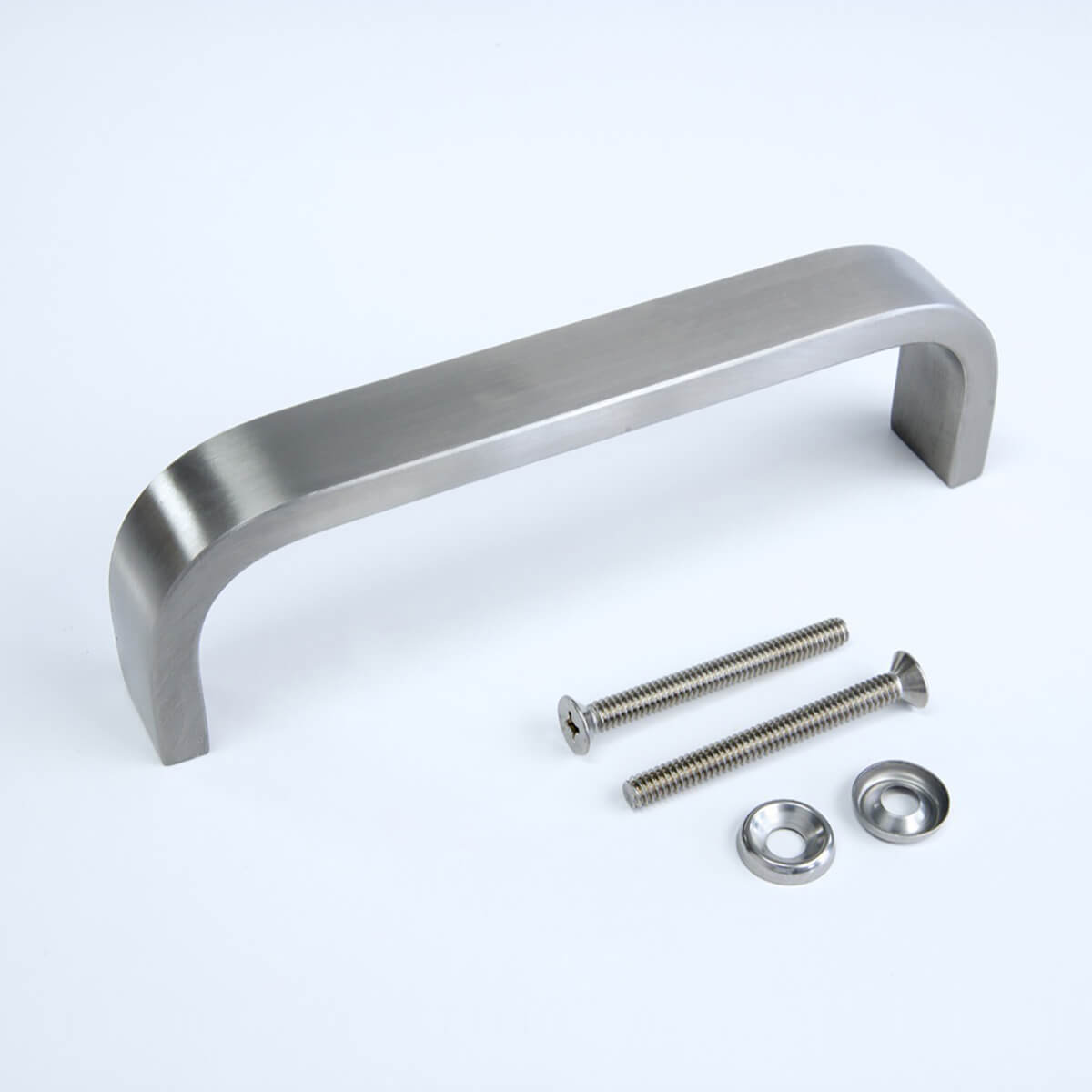 Silver door handle with screws on white background.