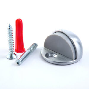 Doorstop with screws and red wall anchor.