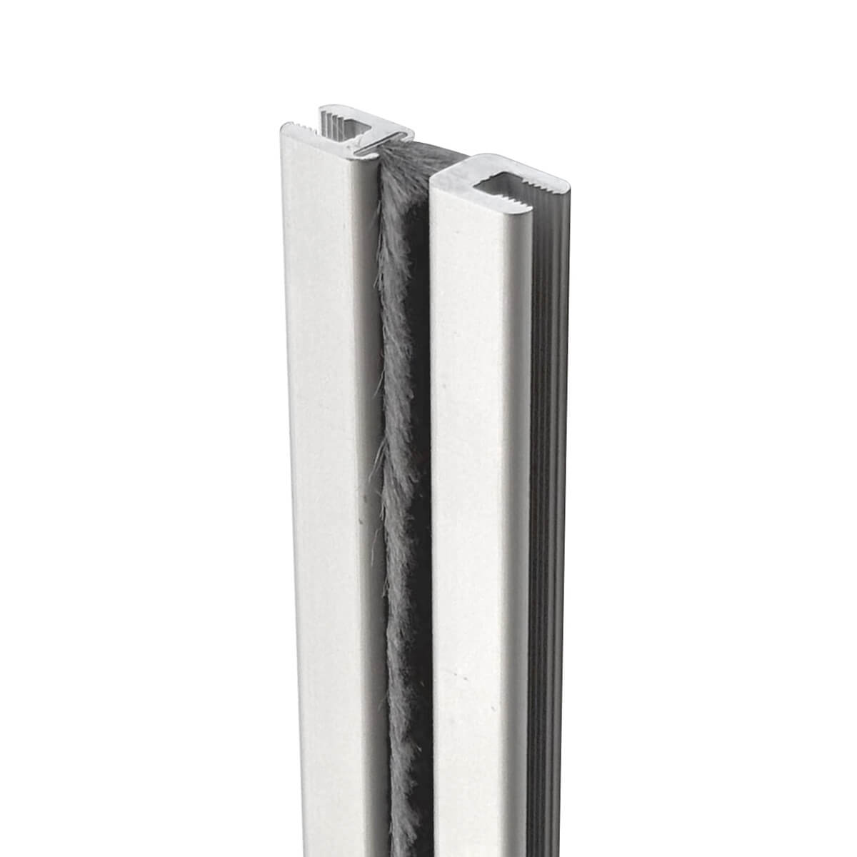 Metal door sweep with brush for sealing gaps.