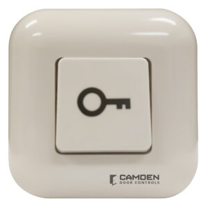 Square white door control button with key symbol.