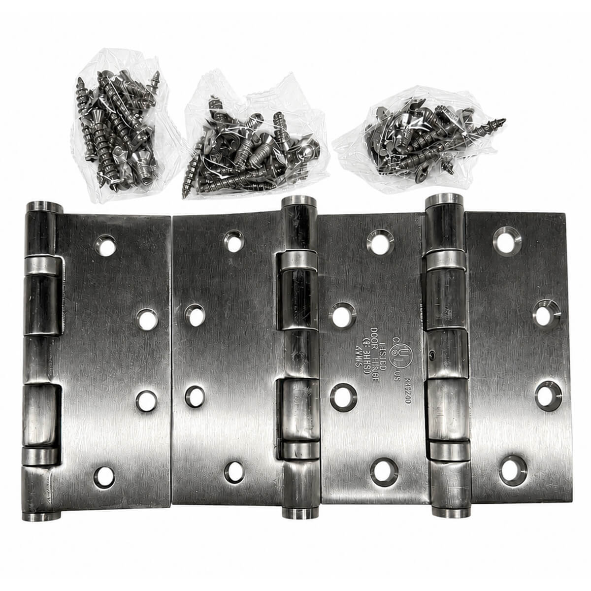 Metal door hinges with screws in plastic bags.